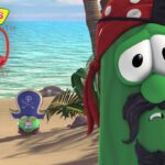 VeggieTales characters on a sunny beach celebrating the 30th anniversary, with a large '30th Anniversary' logo in the sky.