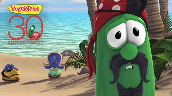 VeggieTales characters on a sunny beach celebrating the 30th anniversary, with a large '30th Anniversary' logo in the sky.