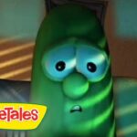 Green VeggieTales character with wide eyes and anxious expression, indoors, VeggieTales logo in the corner.