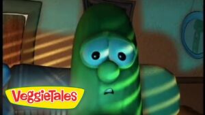 Green VeggieTales character with wide eyes and anxious expression, indoors, VeggieTales logo in the corner.