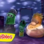 Screenshot from VeggieTales showing two anthropomorphic vegetables on a purple-lit stage with the VeggieTales logo in the corner.