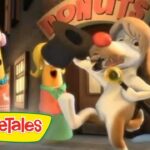 Animated VeggieTales scene: a white dog with a red nose rings a bell while a carrot character watches nearby near a building with VeggieTales signage in the background.