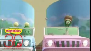 Two VeggieTales characters drive open-top jeeps in a colorful scene, celebrating the 30th anniversary logo in the corner.