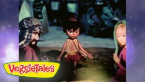 Animated VeggieTales scene: a small character stands in a shallow river with arms out, flanked by two blurred figures; VeggieTales logo in bottom-left.