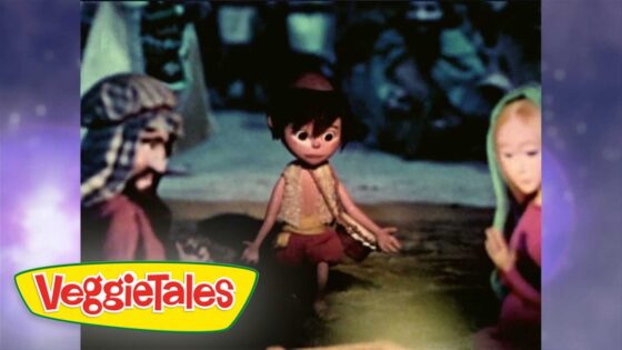 Animated VeggieTales scene: a small character stands in a shallow river with arms out, flanked by two blurred figures; VeggieTales logo in bottom-left.