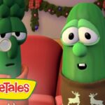 Two VeggieTales characters sit on a pink sofa, a broccoli with a monocle and a green pepper wearing a brown scarf, looking surprised.**(informative)