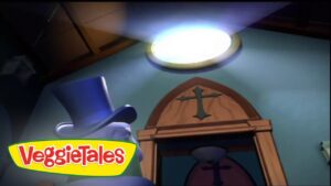 Animated VeggieTales scene with a blue top hat character in a room, logo reading 'VeggieTales' in the foreground.