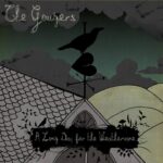 Album cover with a black crow perched on a weather vane atop a rooftop, cloudy green sky and rolling hills in the background; band name at the top and a dark banner with the album title.