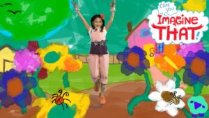 Young girl in pink jumpsuit jumps with arms raised in a bright, cartoon garden scene with colorful flowers and the words 'Can you imagine that!'.] ,