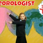 Young girl poses as a meteorologist in front of a colorful chalk-drawn world map backdrop with the word METEOROLOGIST and the Imagine That! logo.