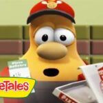 Cartoon yellow character wearing a red delivery cap behind a pizza counter, VeggieTales logo in the corner.