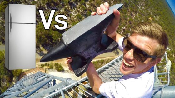Thumbnail showing a man on a metal tower gripping a large metal tool, with a refrigerator image on the left and a bold 'Vs' between them to indicate a comparison video.
