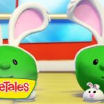 Two green, round VeggieTales characters with large white bunny ears, smiling beside two small white bunnies; VeggieTales logo in the bottom-left corner.