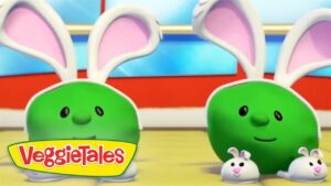 Two green, round VeggieTales characters with large white bunny ears, smiling beside two small white bunnies; VeggieTales logo in the bottom-left corner.