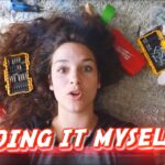 Woman lying on a rug surrounded by tools, screws, and a drill, with bold 'DOING IT MYSELF!' text as a video thumbnail