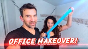 Two people in a partly renovated room; man smiles at camera while woman lifts bright blue tape, with 'OFFICE MAKEOVER!' overlay