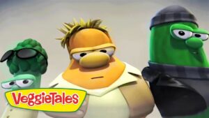 Three VeggieTales animated vegetables stand together with serious expressions, logo VeggieTales in the corner.
