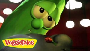 Close-up of a green VeggieTales character with big eyes, looking at a red flower; VeggieTales logo in corner.