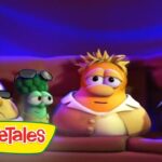 Four VeggieTales characters sit on a couch under blue stage lighting, with the VeggieTales logo in the corner.