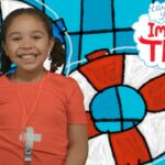 Smiling girl in an orange shirt with a whistle around her neck, standing in front of a blue cartoon lifebuoy background with 'Imagine That' text.