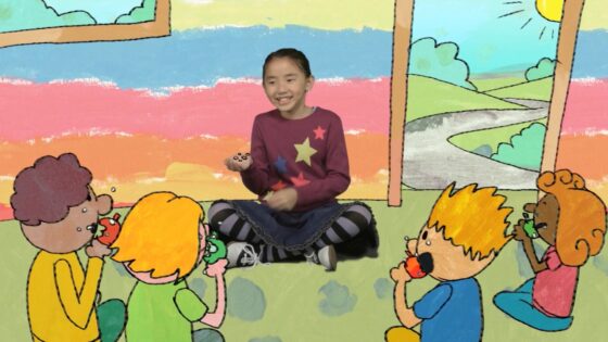 Center girl storyteller: a smiling young girl in a maroon star-pattern sweater sits cross-legged, surrounded by four kids eating apples in a bright, hand-drawn backdrop.