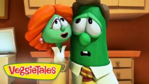 Two VeggieTales characters—a green cucumber and an orange-haired veggie—in a kitchen, looking worried while talking to each other, with the VeggieTales logo in the corner.