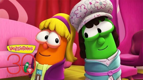 Two VeggieTales characters in colorful costumes pose on a pink stage, with a VeggieTales 30th Anniversary logo.
