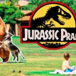 Thumbnail showing a giant dinosaur cutout overlapping a man in a park, with kids filming nearby and a large 'Jurassic Prank' logo in the center.