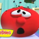 Red veggie character from VeggieTales with a shocked expression and wide eyes in a colorful kitchen set.