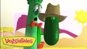 Two VeggieTales characters: a tall green stalk with glasses and a red bow tie beside a green cucumber wearing a wide hat in a bright cartoon landscape with the VeggieTales logo.