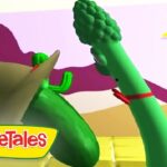 Animated VeggieTales scene: a green cucumber and broccoli arm-wrestle/high-five on a sunny stage, with VeggieTales logo bottom-left.