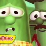 Two worried green peas from VeggieTales stand close, facial expressions downcast with the VeggieTales logo in the corner.