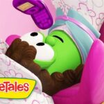 Green VeggieTales character sleeping in a pink chair, wrapped in a white blanket with pink hearts; VeggieTales logo bottom left.