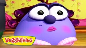 Purple round VeggieTales character with big eyes and pink lips, in a bright room with a VeggieTales logo.