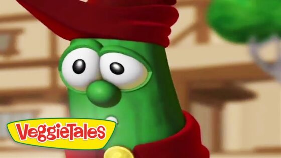 Close-up of a green VeggieTales character with a red hat and yellow logo in the corner.