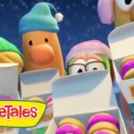 VeggieTales characters wearing winter hats peek over boxes of colorful donuts.