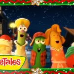 Group of VeggieTales vegetables singing together at night during Christmas, with a festive border and the VeggieTales logo in the corner