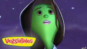 Green VeggieTales character in a dark hood looks surprised against a starry purple sky, VeggieTales logo in the bottom-left corner.