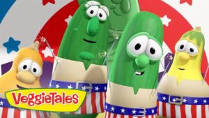 Three cartoon vegetables in patriotic outfits with sparklers and a VeggieTales logo in the corner, ready for a celebratory scene.