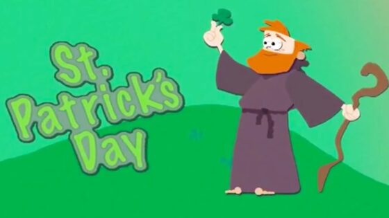 Cartoon leprechaun in a purple robe with a curved staff on a green hill, waving a shamrock, beside the text 'St. Patrick's Day'.