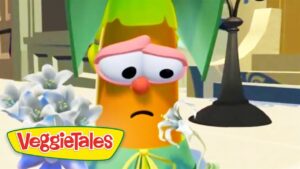 Sad orange carrot character with pink glasses and a frown from VeggieTales.