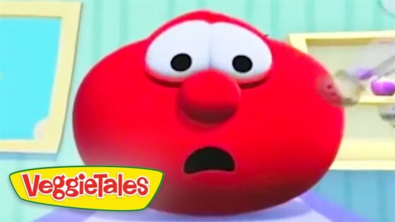 Close-up of a shocked, red VeggieTales character with wide eyes and open mouth. Logo visible in the bottom-left corner.