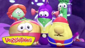 Group of VeggieTales characters posing together on a colorful stage with the VeggieTales logo in the corner.