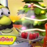 Two VeggieTales characters, a yellow-green chef and a green veggie, lean toward a tray of red apples in a cozy kitchen with a Christmas tree in the background, VeggieTales logo visible.
