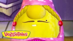 Bright yellow VeggieTales character with braided hair in a pink hoodie, making a puzzled face.