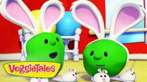 Two green VeggieTales characters with white bunny ears stand in a bright playroom; VeggieTales logo appears in the foreground.
