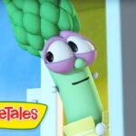 Cartoon green vegetable from VeggieTales peeking through a doorway, with purple glasses and a sleepy expression.