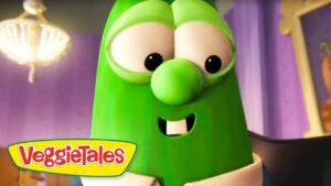 Larry the Cucumber from VeggieTales smiles at the camera, with the VeggieTales logo visible in the bottom-left corner.