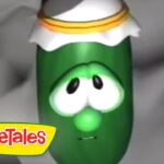Green VeggieTales character with a sad expression wearing a white hat with orange trim, logo visible in corner.