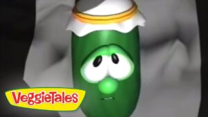 Green VeggieTales character with a sad expression wearing a white hat with orange trim, logo visible in corner.